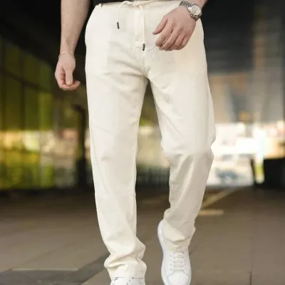 Pánské krémové lněné kalhoty s kapsami, gumou a tkaničkami v pase 3